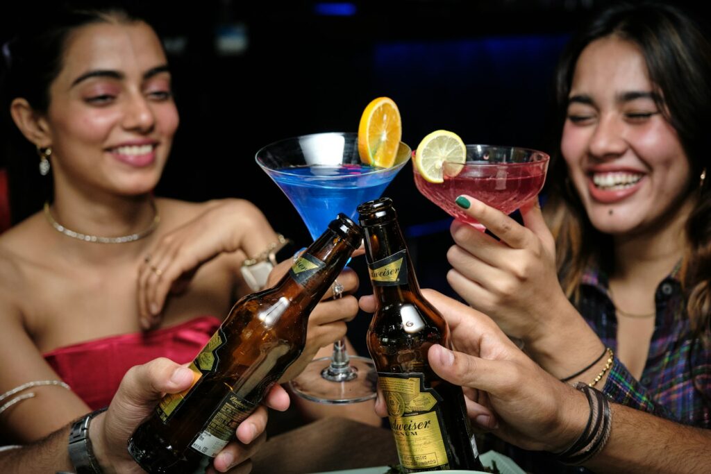 Group of friends sharing drinks at a bar table