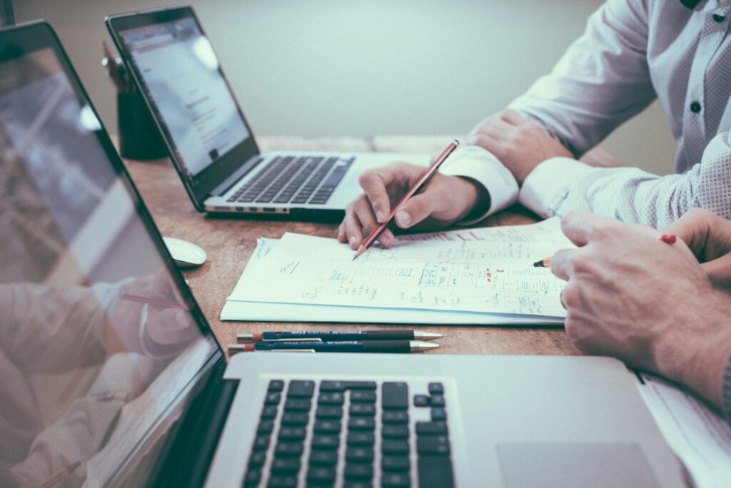 Business owner reviewing marketing reports on a laptop