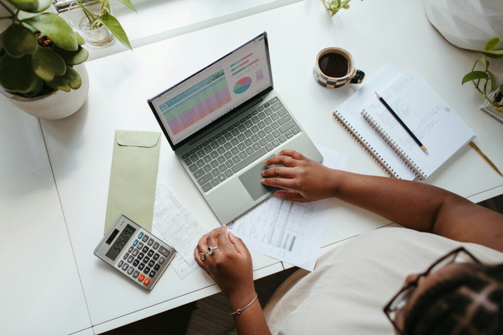 Business owner planning a monthly ad budget on a laptop