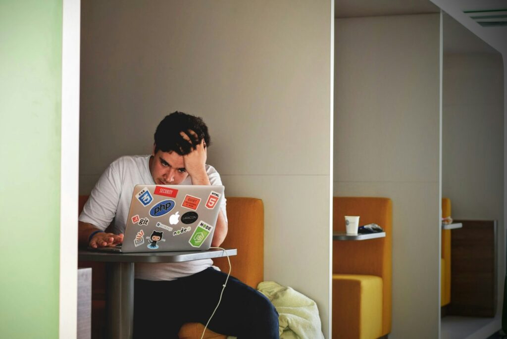 Business owner on a laptop checking why Facebook ads are not converting