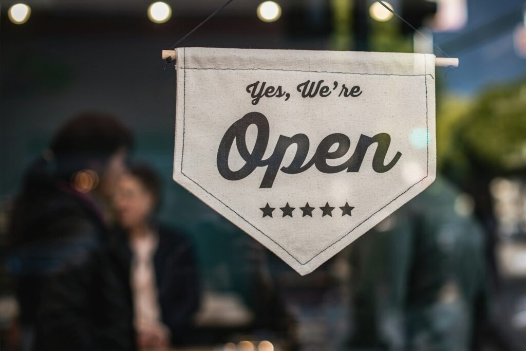 Open sign on a small business storefront found through Google Maps