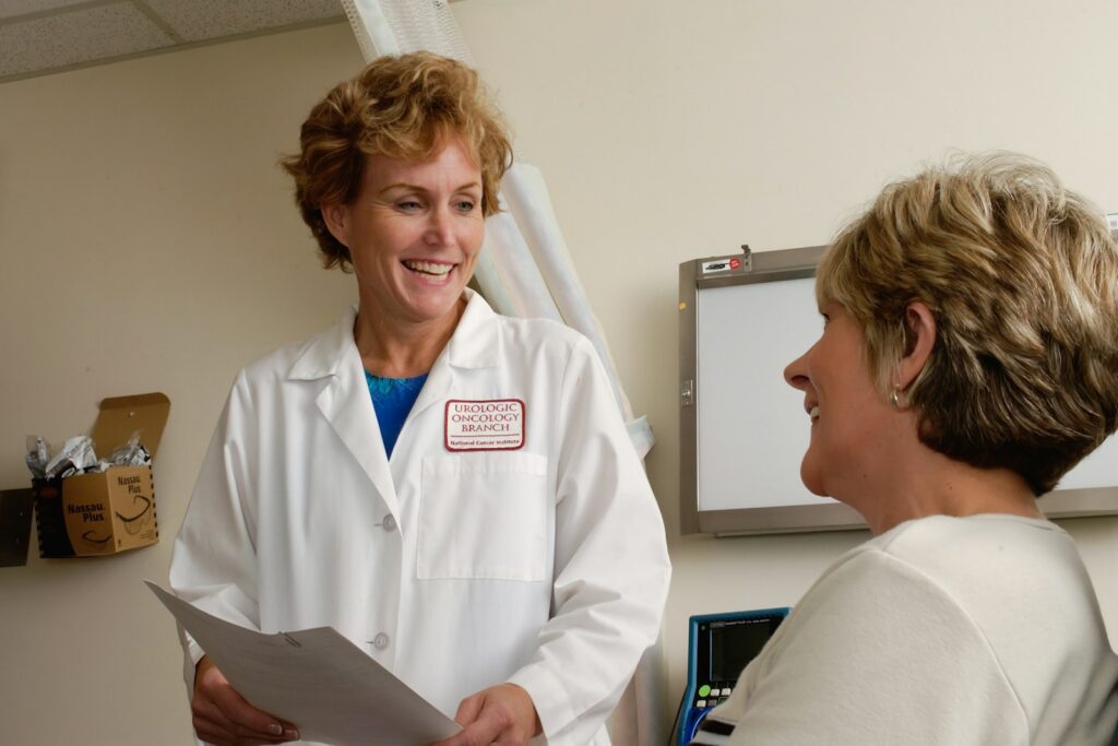Smiling doctor talking with a patient in a medical practice