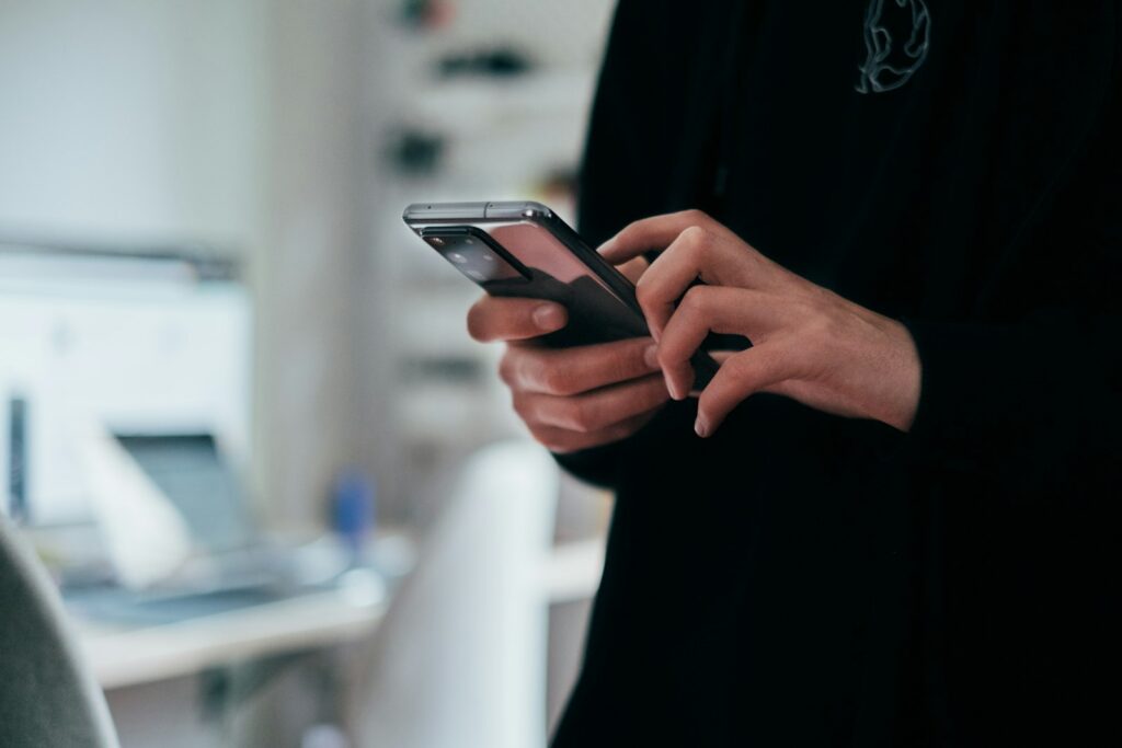Person browsing a mobile landing page on a smartphone