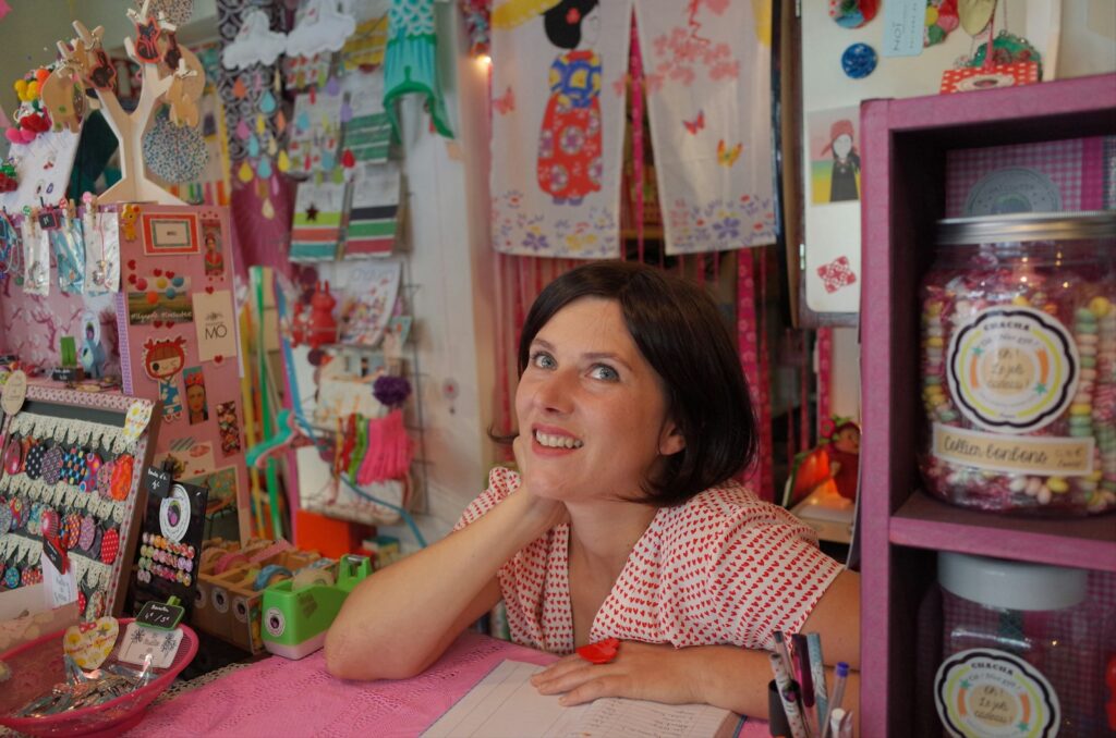 Small business owner working at her desk on social media content