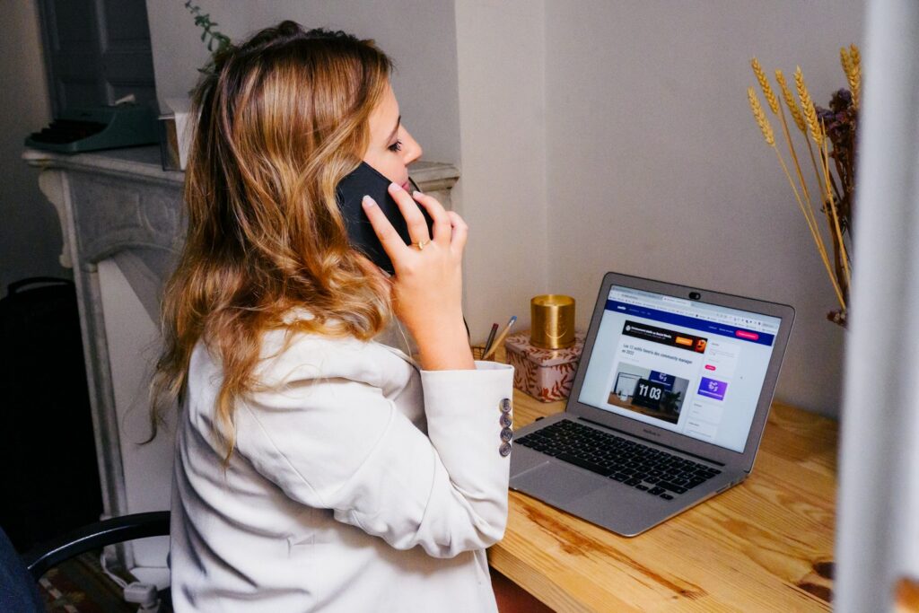 Woman at her desk calling back a new lead within minutes
