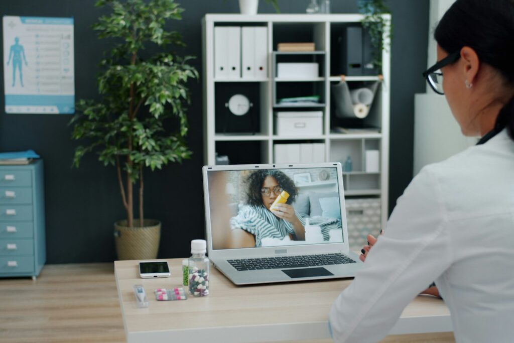 Doctor consulting a patient over a telehealth video call