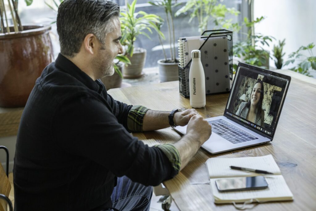 Man on a video call using a laptop